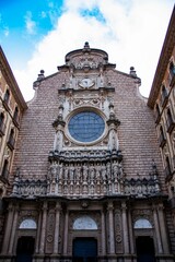 Vertical shot of the frontal facade of the Monastery of Santa Maria de Montserrat