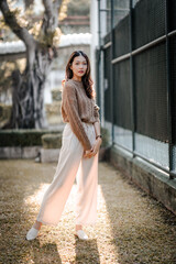 Beautiful Asian woman happy girl and wearing warm clothes winter and autumn portrait at outdoor in park.