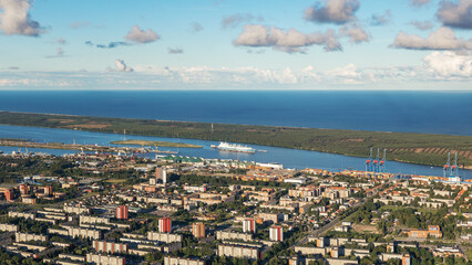 Landscape from bird eye view for Klaipeda logistic port. The Curonian Spit, the Baltic Sea, a residential apartment district nearby