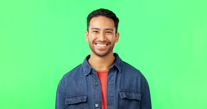 Man, laughing and portrait on green screen in studio with space for comic joke and funny emoji. Face of asian male model person laugh for happiness or positive mindset on chroma key background