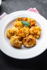 cauliflower with cheese baked vegetable meal food snack on the table copy space food background rustic top view 