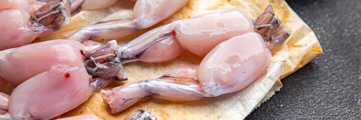 frog legs raw meat fresh meal food snack on the table copy space food background rustic top view