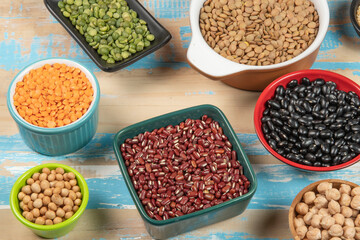 assorted bowls with raw grain and seeds top view