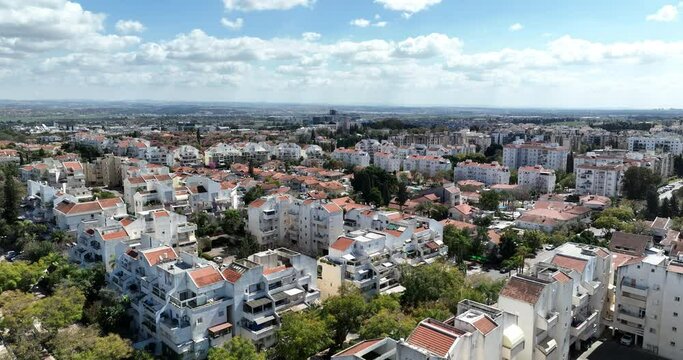 Aerial footage of the skyline of the northern city of Kfar Saba. Filmed in C4K Apple ProRes 422 HQ