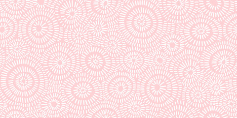 Seamless hand drawn concentric sun ray circles pattern in pastel pink and white. Abstract barnacle or coral sea life motif background texture. Trendy baby girl blanket, clothing or nursery wallpaper.