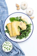 Concept of tasty food, thin pancakes with filling, top view