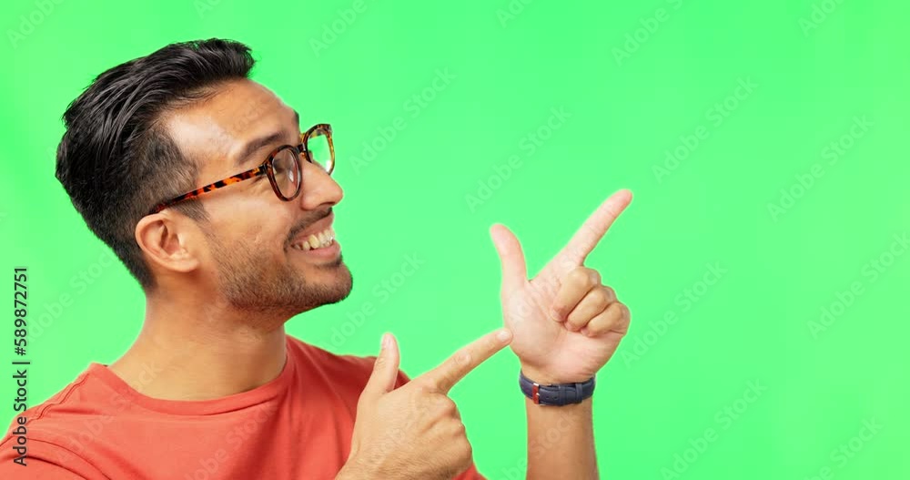 Poster face, space and pointing with a man on a green screen background in studio for marketing or product 