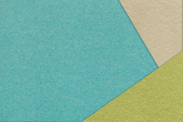Fototapeta na wymiar Texture of craft cyan color paper background with green and beige border. Vintage abstract cerulean cardboard.