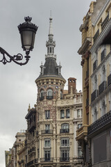 Fototapeta na wymiar Old building in the center of the city of Madrid with a beautiful and curious circular tower