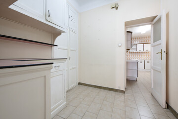 old kitchen with large pantry in a nearby room