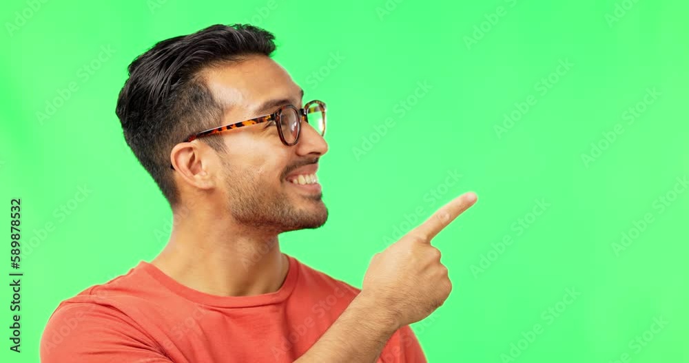 Poster face, marketing and pointing with a man on a green screen background in studio for advertising or pr