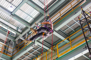 Male worker training rope access