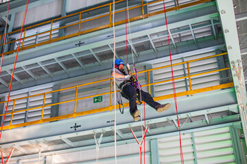 Male worker training rope access