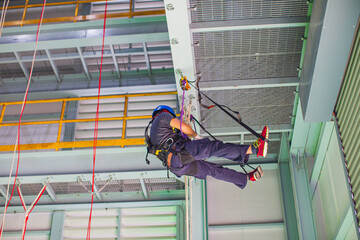 Male worker training rope access