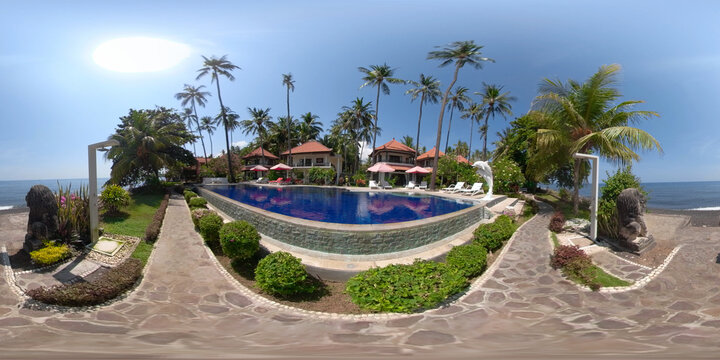 vr 360 swimming pool in luxury hotel with sun beds by sea. tropical resort with pool. Travel concept.