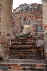 ruins and monks in church in Wat Borom Phuttharam Ayutthaya, Thailand