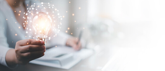 thinking and creative concept, Close up the light bulb and woman working on the desk, Creativity, and innovation are keys to success,  new idea and innovation with Brain and light bulbs,big data