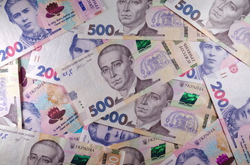 Obraz premium Money of Ukraine. Background of ukrainian hryvnia banknotes. Hryvnia 500, 200. Uah. Money and save concept. 