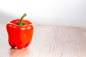 red pepper on wooden background