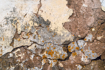 Old concrete wall with destroyed plaster