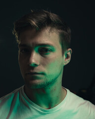 An envious man in a dark room