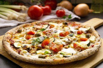 Fresh  homemade vegetarian Pizza, healthy pizza crust with wholemeal flour, sesame and linseeds, topping with vegetables, mozzarella, hollandaise sauce and cashew nuts - 589894702