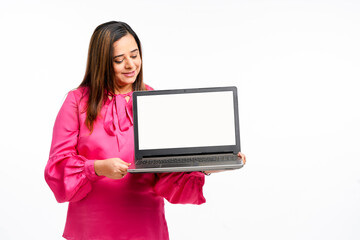 Young indian woman showing laptop screen on white background.