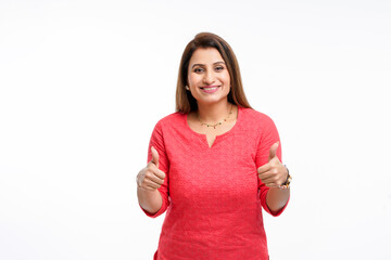 Young indian woman showing thumps up on white background.