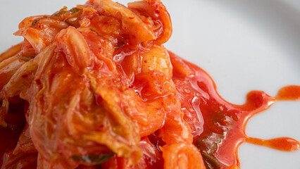 Close up of a pile of tasty Korean kimchi. This fermented delicacy can be eaten on its own or as a...