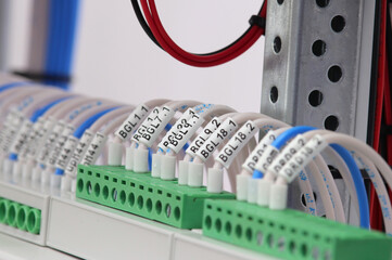 Marking of insulated mounting wires with thermal printed tape.