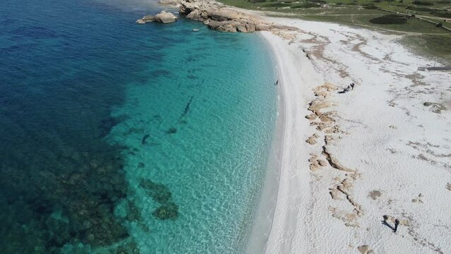 aerial view of the crystalline waters of the sea of ​​is arutas and mari ermi beach in sardinia
