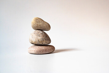 Stack of white natural zen stones. your mind, your soul balancing, begging, meditation concept.	
