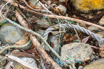 lost industrial fishing gear weathering on a beach in patagonia chile  shedding micro plastic particles into the food chain - obrazy, fototapety, plakaty