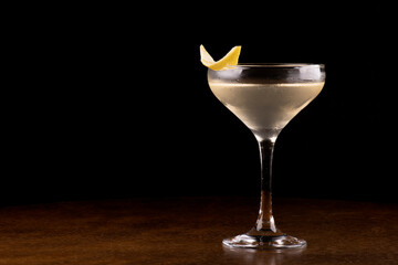 Glass of Agent 007's Special Vesper Cocktail with orange peel garnish close-up