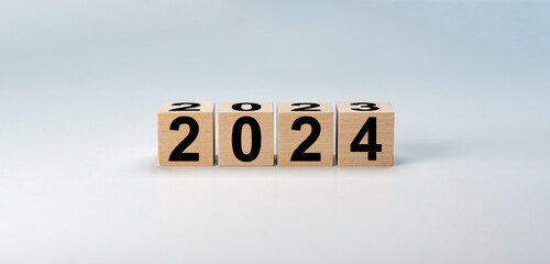New year 2024 on wooden cubes. Wooden cube with numbers 2024 beginning of new year. wooden cube...