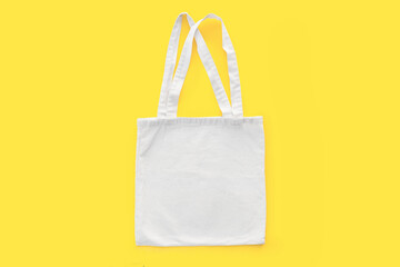 White cotton, canvas, tote, mesh bag on yellow background. Zero waste, no plastic, eco friendly...
