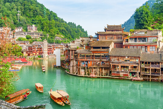 Awesome view of wooden tourist boats on the Tuojiang River