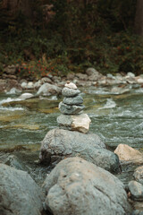 stones stacked in a river concept of peace, harmony, balance