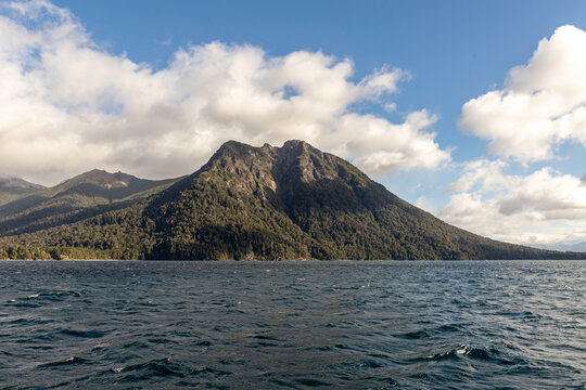 panoramic photo of a mountain and a lake