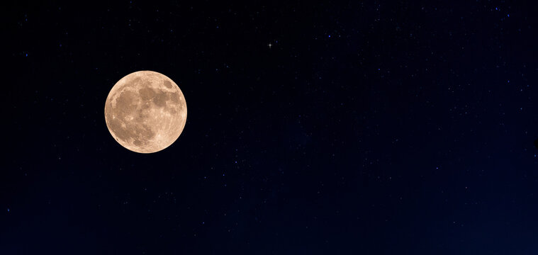 moon on dark blue night sky background, starry universe, nebula and galaxies with noise and grainy, selective focus.Earth's Moon Glowing On Black Background.
