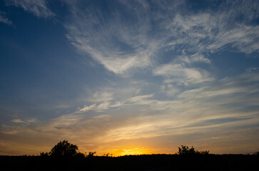 Fototapeta na wymiar Sunset in the sky with rain clouds