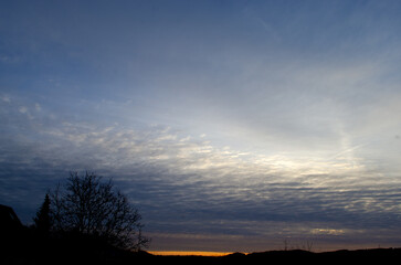 Fototapeta na wymiar Sunset in the sky with rain clouds