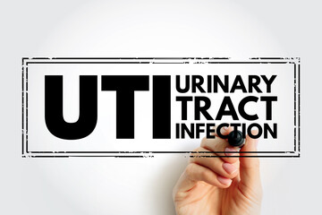 UTI Urinary Tract Infection is an infection in any part of your urinary system - kidneys, ureters, bladder and urethra, acronym text stamp concept for presentations and reports