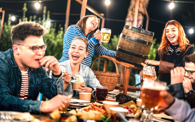 Happy people group having fun drinking out at beer garden feast - Social gathering life style...