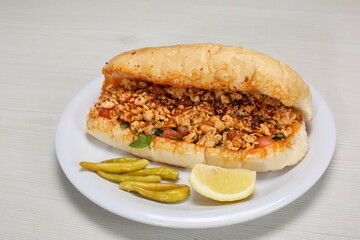 Chicken tantuni Sandwich with pickles and lemon slice