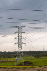 Electric power lines, electricity transmission towers.