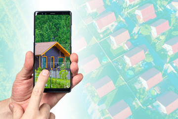 Cottage in phone screen. Hands with smartphone. Real estate agency application concept. Website for buying real estate. House selection via mobile phone. Digital real estate auction metaphor