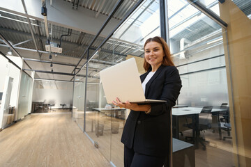 Fototapeta premium Portrait of beautiful architect in coworking center