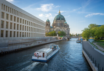 Boat at spree river and Berlin Cathedral - Berlin, Germany