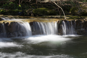 Obraz premium Small waterfalls of the River Yera as it passes through Vega de Pas (Cantabria)
